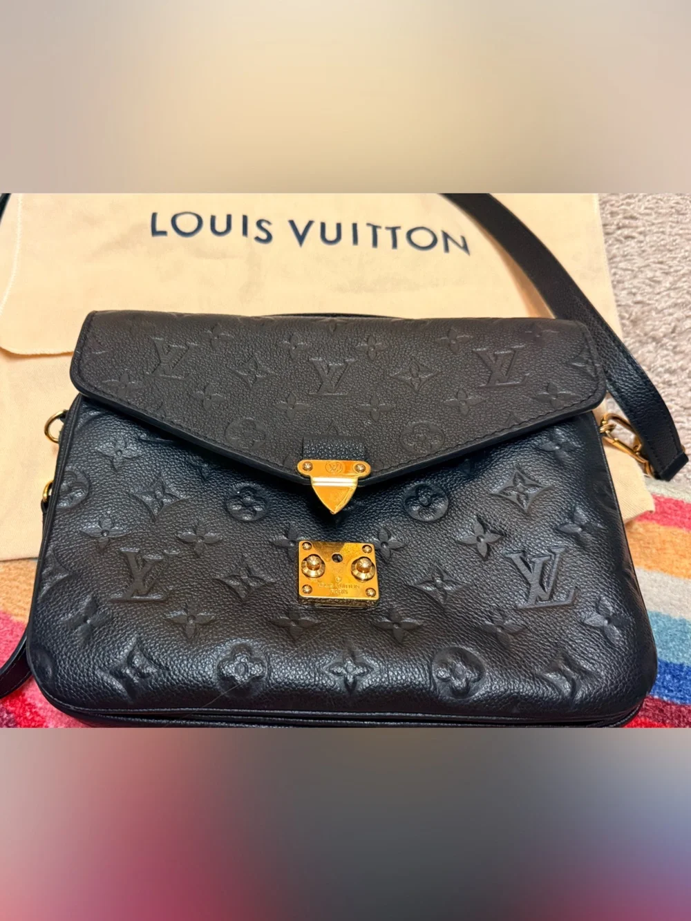 Beautiful Louis Vuitton Pochette Métis in black Monogram Empreinte leather